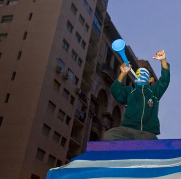 MONTEVIDEO - JULY 02: Urugayan fun celebrating the first semifinals in 40 years after beating Ghana on 2010 world cup on July 02, 2010 in Montevideo, Uruguay 