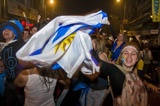 MONTEVIDEO - JULY 02: Urugayan fun celebrating the first semifinals in 40 years after beating Ghana on 2010 world cup on July 02, 2010 in Montevideo, Uruguay 