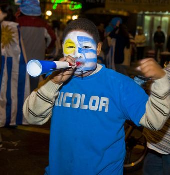 MONTEVIDEO - JULY 02: Urugayan fun celebrating the first semifinals in 40 years after beating Ghana on 2010 world cup on July 02, 2010 in Montevideo, Uruguay 