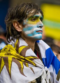 MONTEVIDEO - JULY 06: Uruguayan football fun watching the matcch between Uruguay and Netherlands in the 2010 world cup semifinal  on July 06, 2010 in Montevideo, Uruguay 