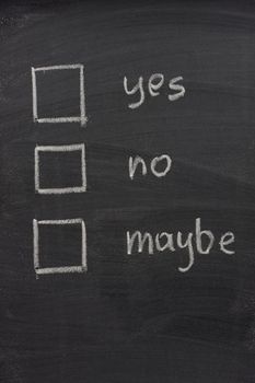yes, no and maybe vottng check boxes sketched with white chalk on blackboard