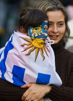 MONTEVIDEO - JULY 06: Uruguayan football fun watching the matcch between Uruguay and Netherlands in the 2010 world cup semifinal  on July 06, 2010 in Montevideo, Uruguay 