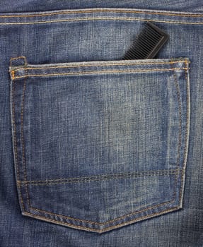 blue jeans back pocket with a black comb