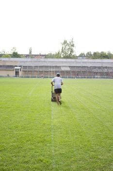 the man who mows the grass on the football field