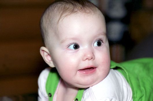 Portrait of infant looking at something with interest