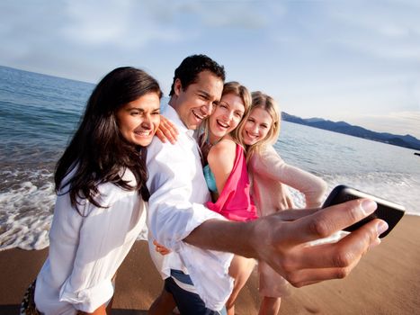 A group of friends taking a self portrait with a camera phone