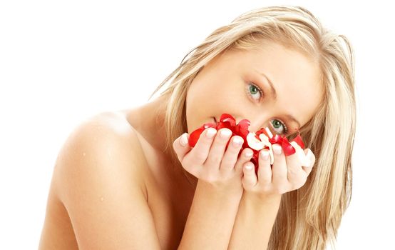 portrait of lovely blond in spa with red and white rose petals