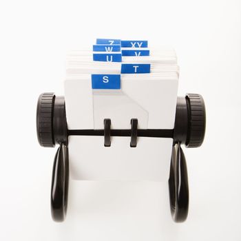 Rolodex with blue letter tabs.