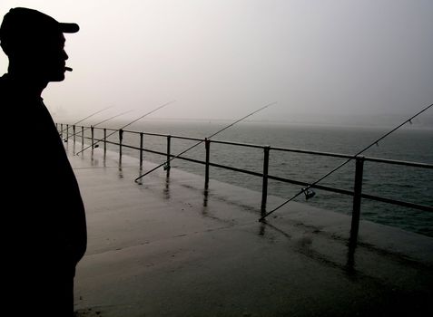 an angler fishing in the sea