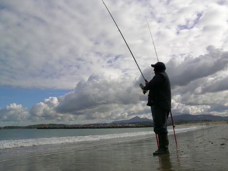 an angler fishing in the sea