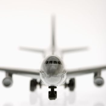 Selective focus of miniature model commuter jet airplane.