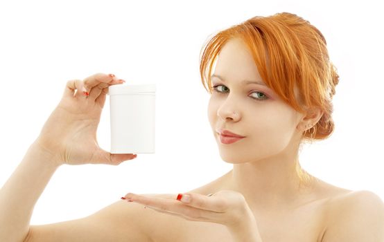 lovely redhead showing blank medication container over white