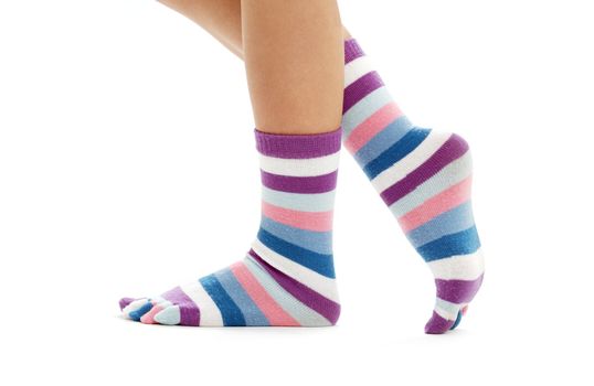 beautiful legs in funny socks over white