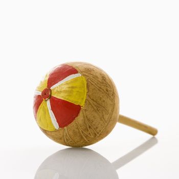 Handmade Mexican maraca percussion musical instrument against white background.