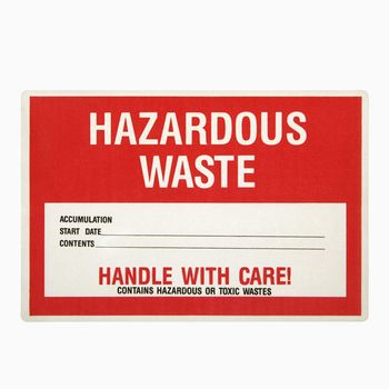 Hazardous waste sign against white background.