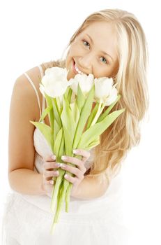 picture of happy blond with white tulips
