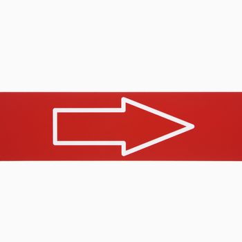 Red sign with arrow against white background.