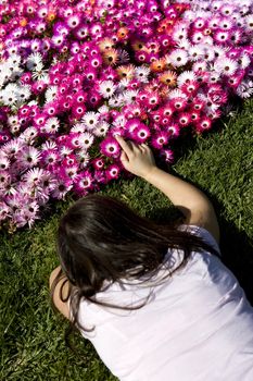 young woman caressing flower bouquet