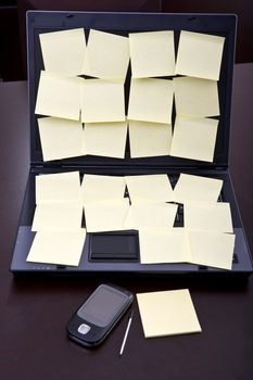 laptop computer full of blank post-it reminders