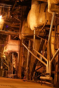 Pipes and tubes and chimney at a power plant   