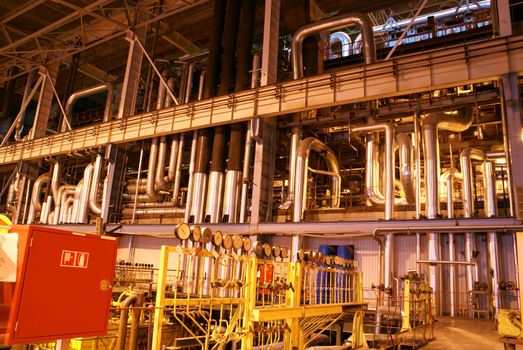 Pipes and tubes and chimney at a power plant            