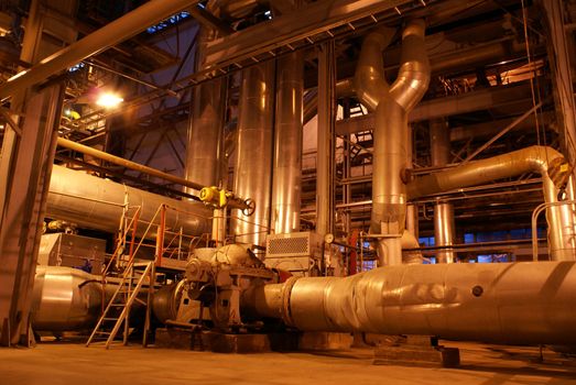 Pipes and tubes and chimney at a power plant     