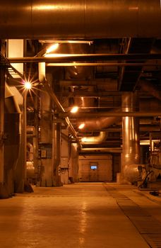 Pipes and tubes and chimney at a power plant