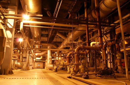 Equipment, cables and piping as found inside of a modern industrial power plant           