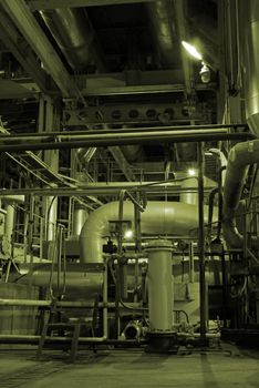 Equipment, cables and piping as found inside of a modern industrial power plant        