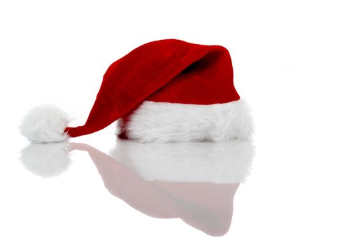 A red santa hat isolated on white with reflection