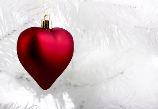 Christmas ornaments hanging from a white tree