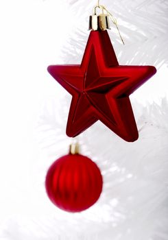 Christmas ornaments hanging from a white tree