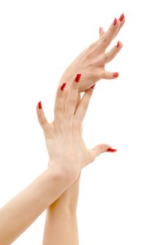 picture of two hands with red nails over white