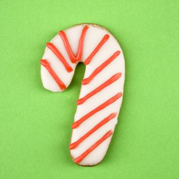 Candy cane sugar cookie with decorative icing.