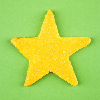 Star sugar cookie with decorative icing.