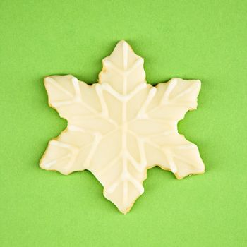 Snowflake sugar cookie with decorative icing.