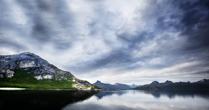 A panorama of mountains and ocean in Norway