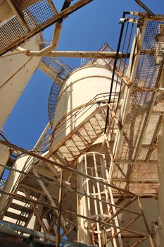Cement industry silos seen from below