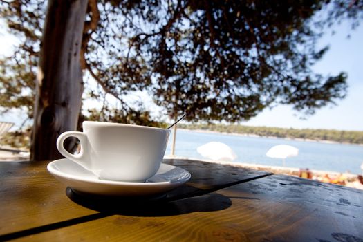 A coffee cup in an outdoor cafe 