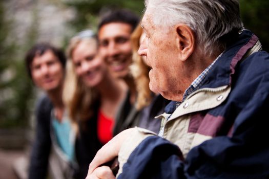 An elderly man telling stories