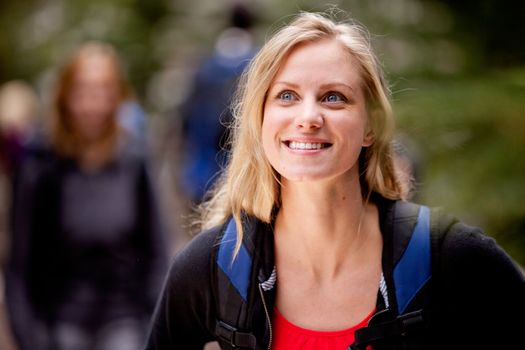 A portrait of a young woman enjoying the outdoors