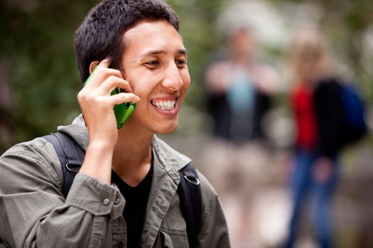 A man talking on a cell phone outdoors