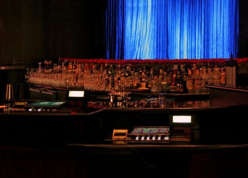 A modern bar counter with a blue background.