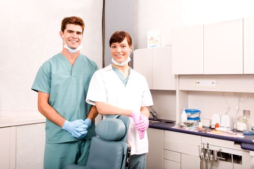 A portrait of a dentist and an assistant