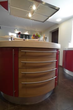 Red modern kitchen. Interiors. Cupboard. Table top.