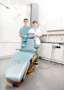 A happy dental team, dentist and assistant in a dental clinic