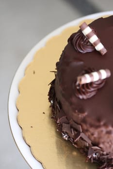 Close up of a chocolate cake on a plate.