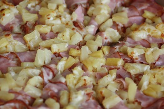 Close up of a Hawaiian Pizza.