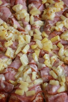 Close up of a Hawaiian Pizza.