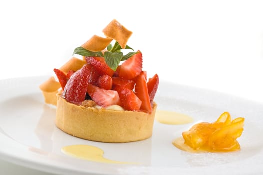 Sweet dessert with strawberries, on white, studio shot.